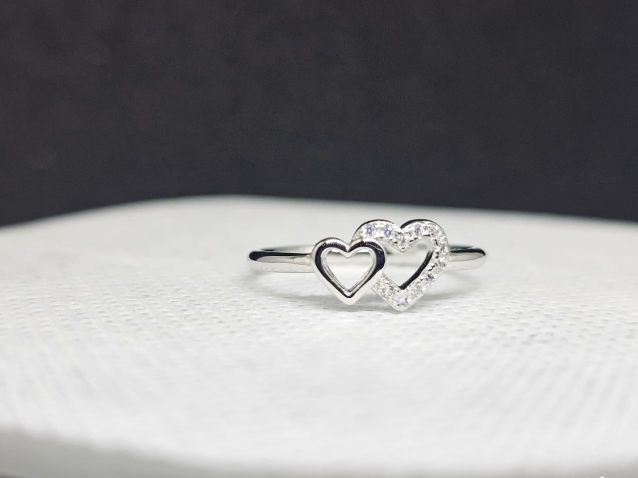 "Heart Song" Sterling Silver Interlocking Heart Ring with CZ Trail