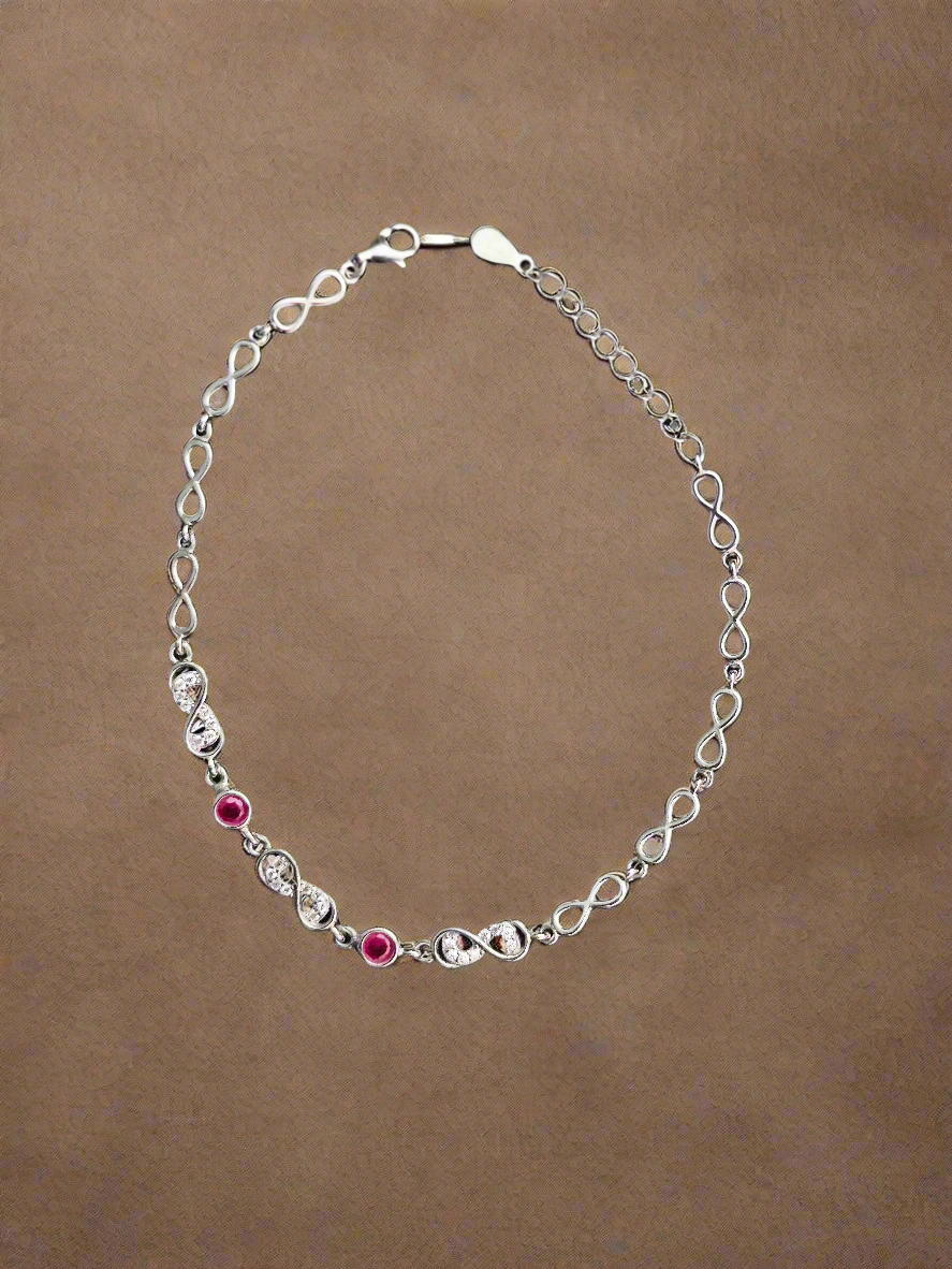 Elegant Silver Infinity Link Bracelet with Ruby Accents for Women