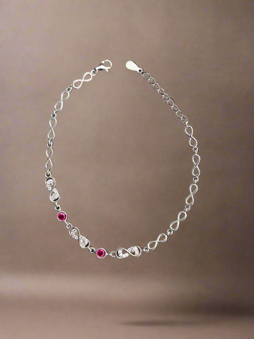 Elegant Silver Infinity Link Bracelet with Ruby Accents for Women