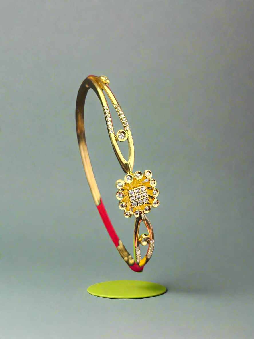 Elegant Gold-Toned Floral Bangle with Crystal Accents