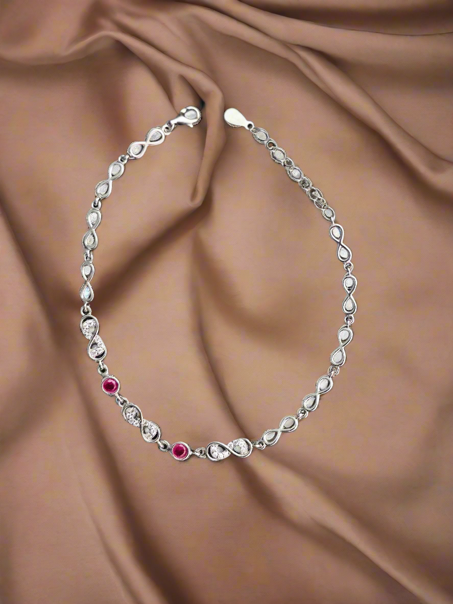 Elegant Silver Infinity Link Bracelet with Ruby Accents for Women