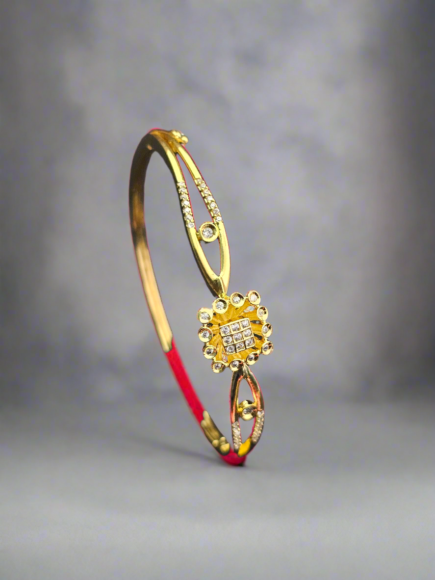 Elegant Gold-Toned Floral Bangle with Crystal Accents