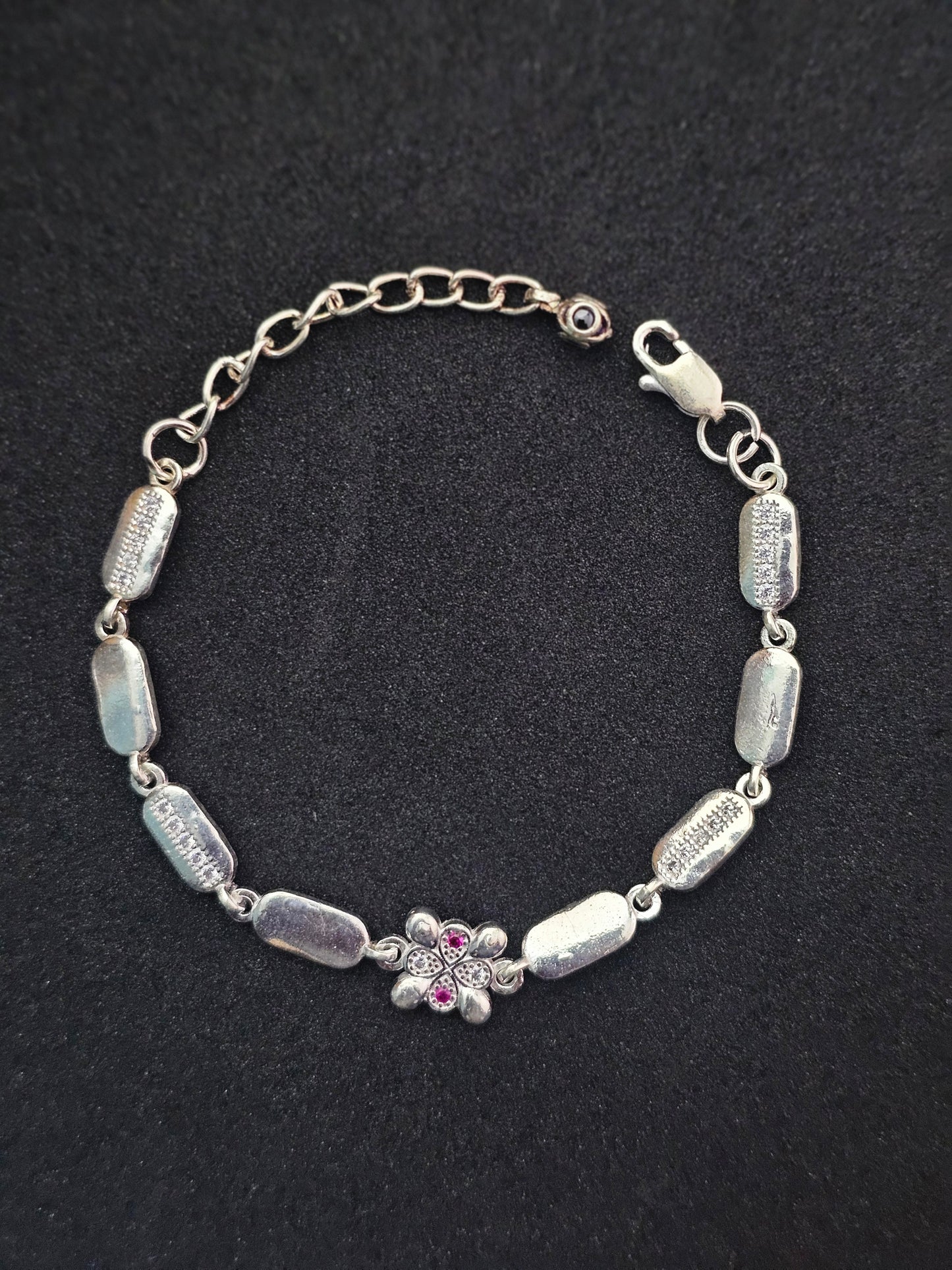 Sterling Silver Charm Bracelet with Floral Accent and Cubic Zirconia Details