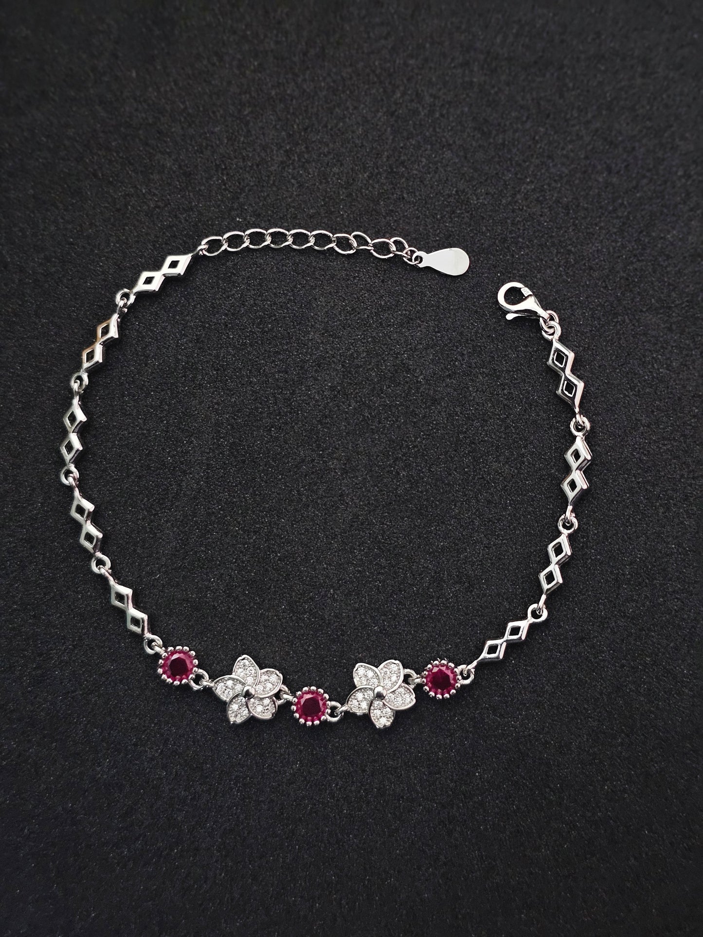 Elegant Floral & Gemstone Silver Bracelet Sparkling Ruby Accents