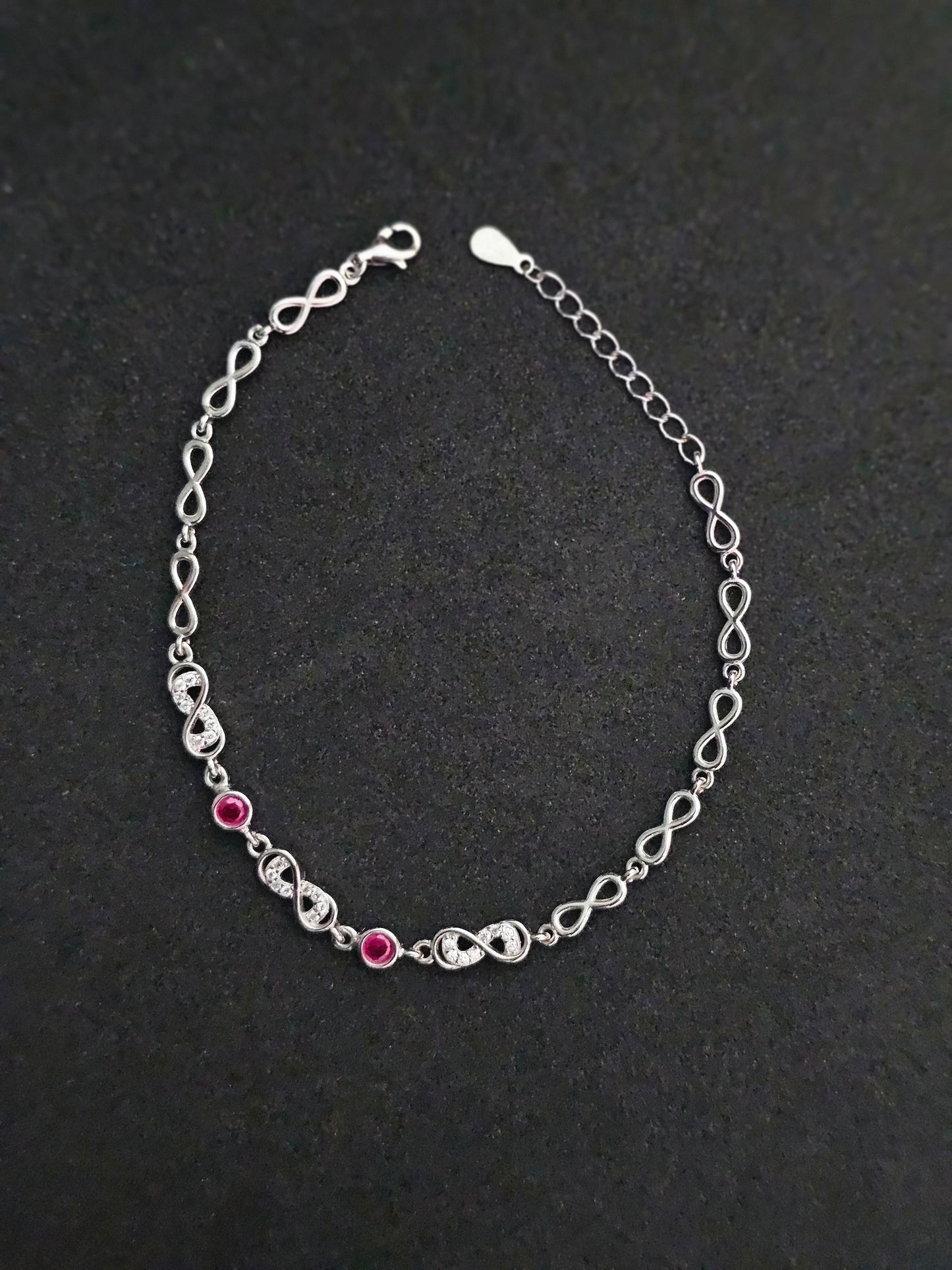 Elegant Silver Infinity Link Bracelet with Ruby Accents for Women